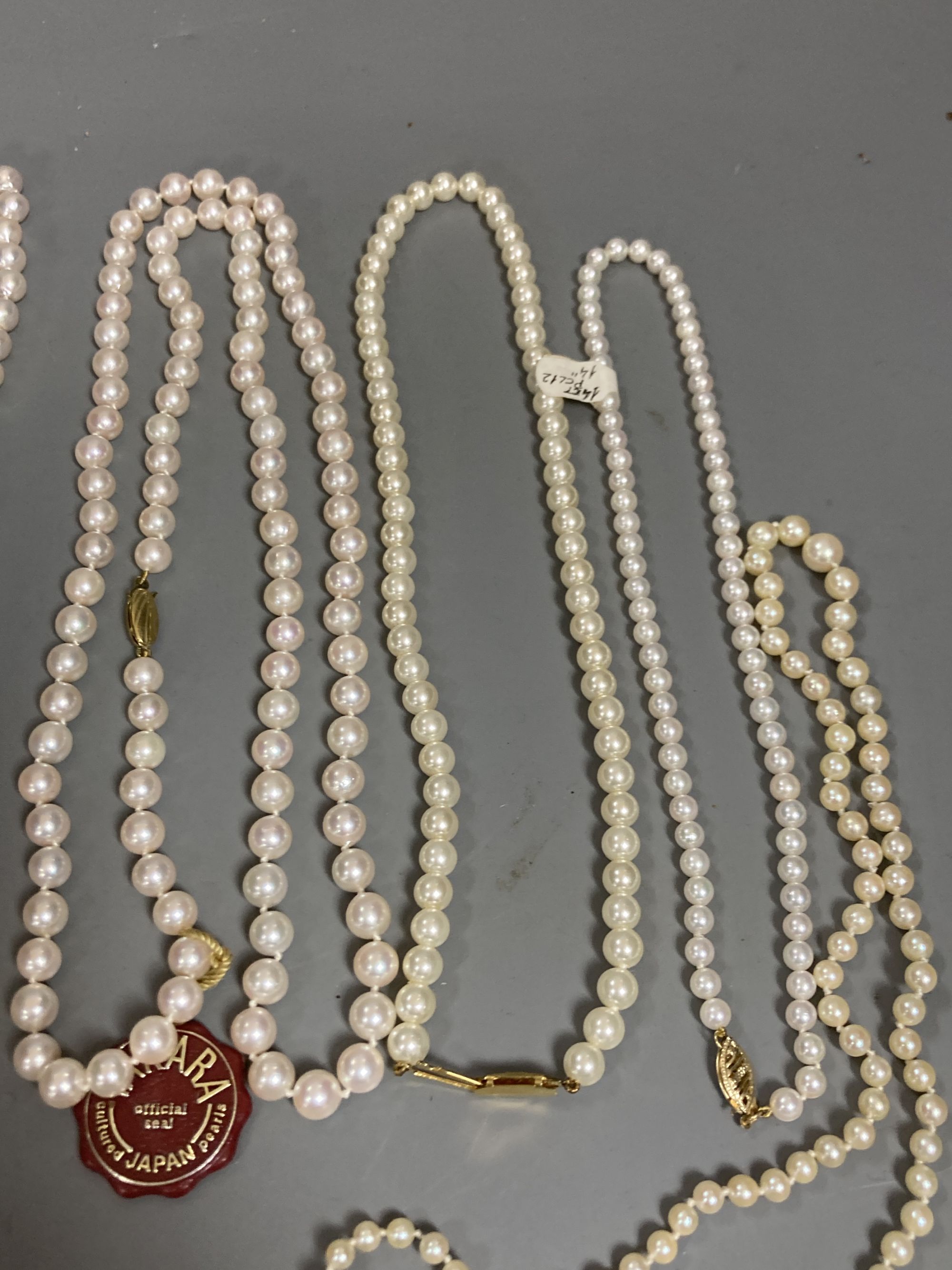 Four assorted modern single strand cultured pearl necklaces, longest 83cm, one other 9ct and cultured pearl necklace(a.f.) and two simulated pearl necklaces.